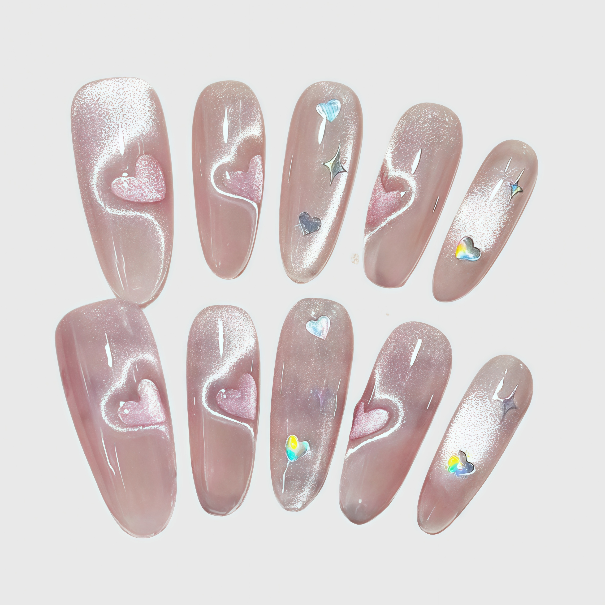 Long almond press-on nails with pink cat eye shimmer, heart accents, and holographic star charms. Main image