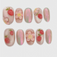 Oval-shaped pink iridescent press on nails with 3D strawberry and cherry blossom decorations, jelly-style fruity floral fake nails