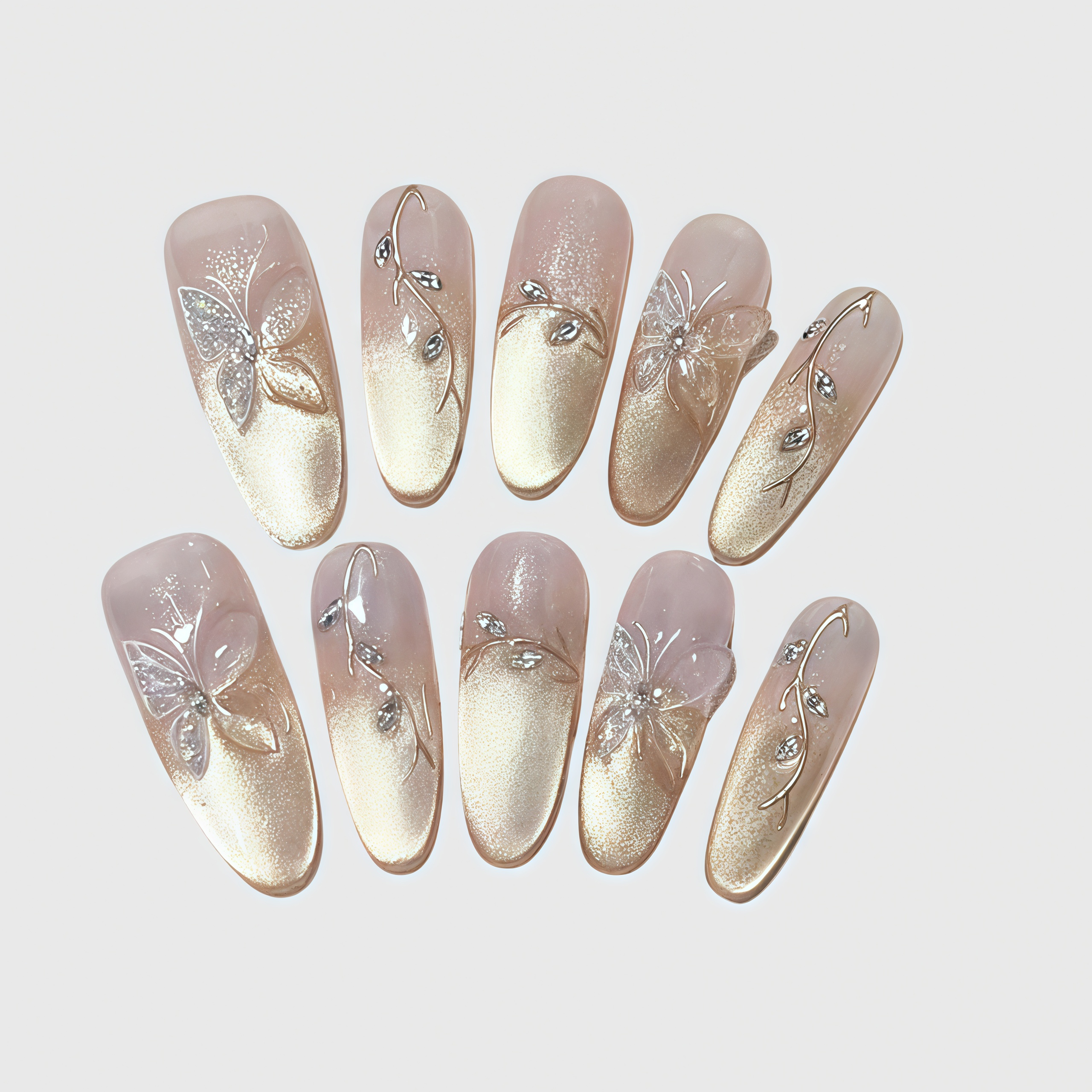 Almond-shaped press-on nails with gold gradient finish, 3D butterfly decorations, and crystal vines.
