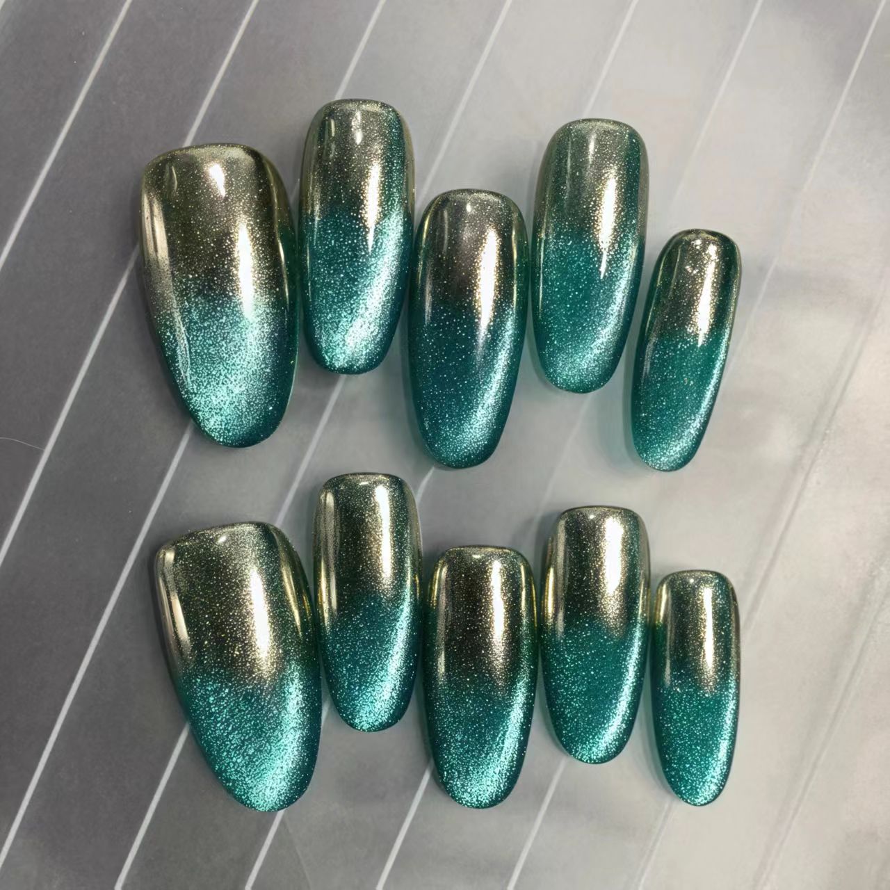 Coffin shape green chrome press on nails with glitter gradient and metallic finish

