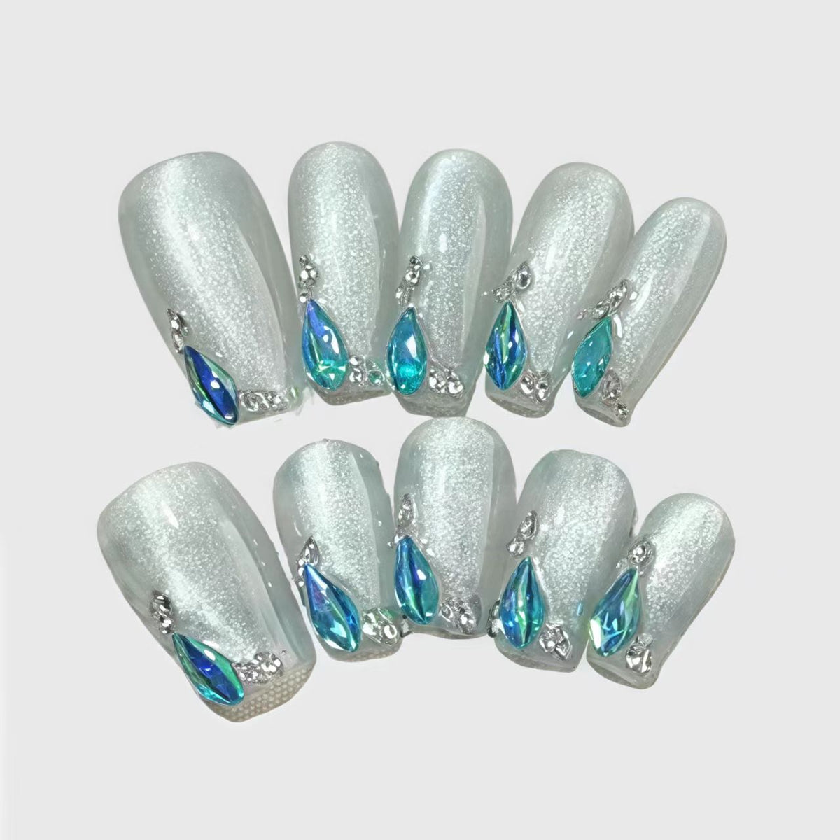 Square-shaped glitter white press on nails with blue teardrop rhinestones and silver accents, elegant winter nail set for formal occasions