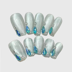 Square-shaped glitter white press on nails with blue teardrop rhinestones and silver accents, elegant winter nail set for formal occasions