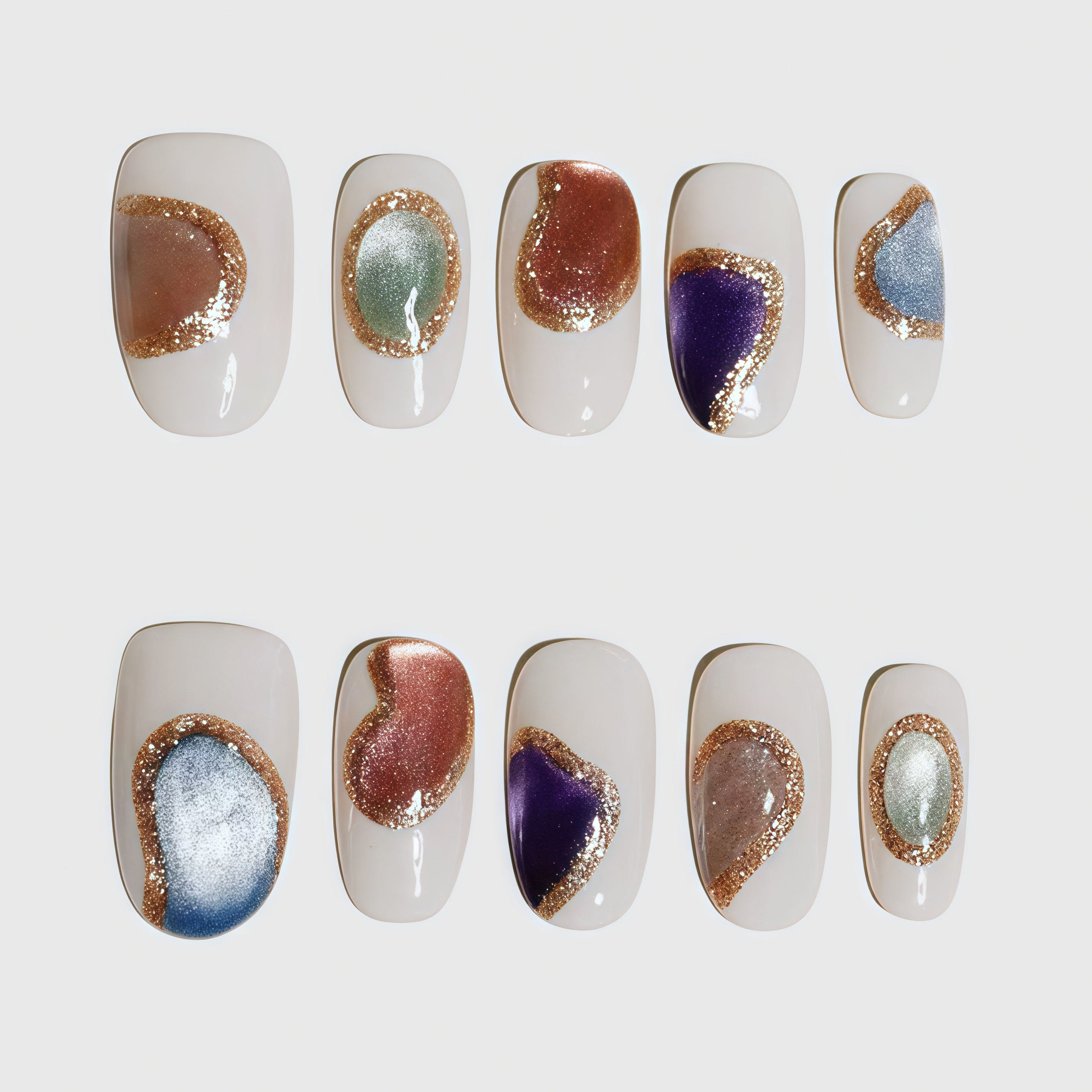 Round short press-on nails with nude base, decorated with irregular metallic color blocks outlined in gold glitter; includes blue, purple, silver, orange, and green elements in abstract style. Main image