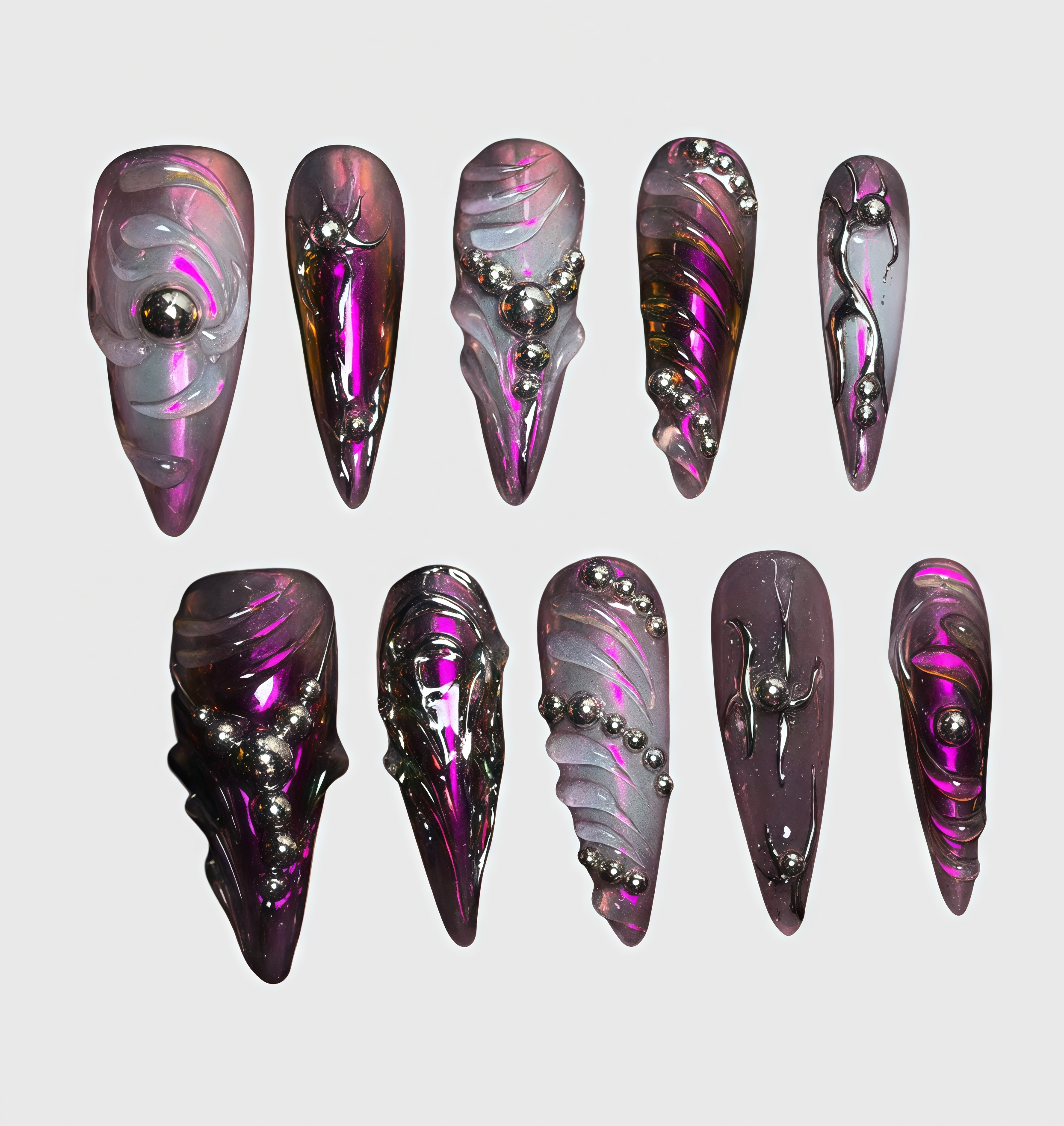 Stiletto-shaped cyberpunk press-on nails in chrome purple with metallic texture, 3D carved swirls and silver bead accents Main image